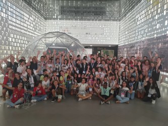 75 children aged 10 to 14 pose for a group picture after their Moon Camp experience