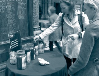 Visitors answer a question  at the Natural History Museum, London, UK