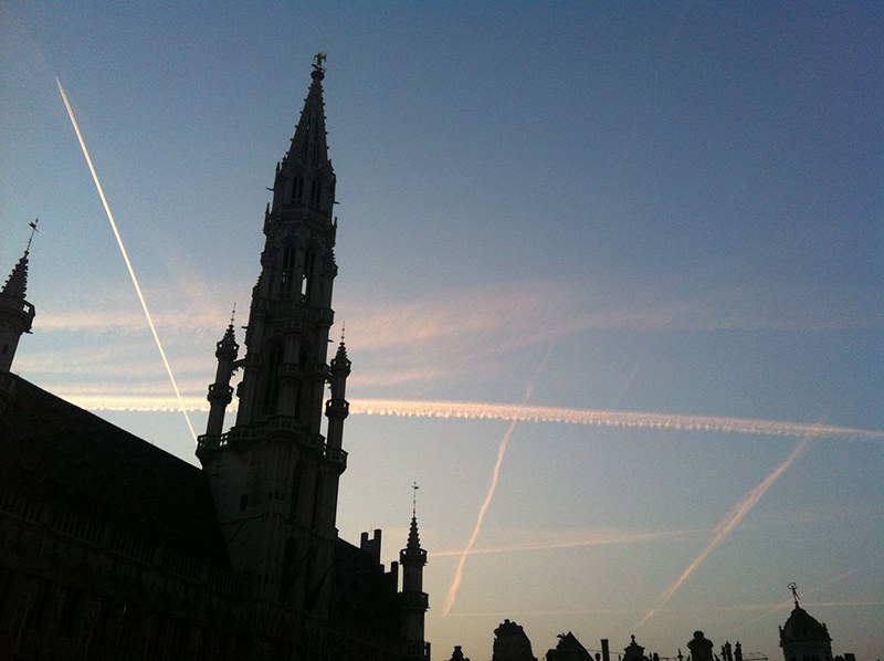 Airplane condensation trails in the Brussels sky - which "chemtrail" conspiracy theorists claim to be chemical substances governments spray to keep populations subdued. Photo Antonio Gomes da Costa