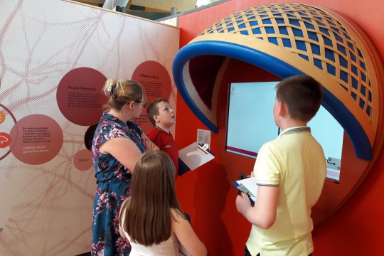 Kerrie and e=mc² looking at exhibits in the Brain Zone, as part of Life’s project for Young People with Autism Spectrum Disorders