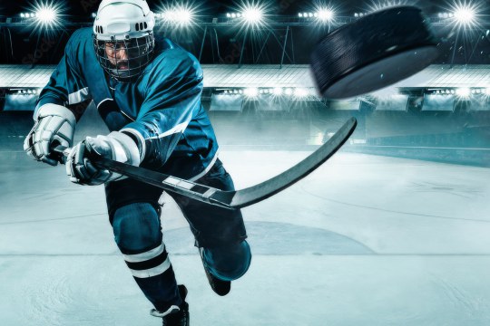 cover image of HOCKEY: Faster Than Ever containing a hockey player shooting a puck