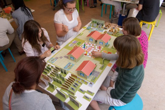 Children playing a board game on urban diversity at the BiodiverCITY Exhibition of the Royal Belgian Institute of Natural Sciences