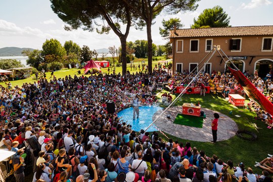 The audience attending a show at the Einstein’s Island – Isola Polvese, Trasimeno Lake Italy. Photographer: Marco Giugliarelli