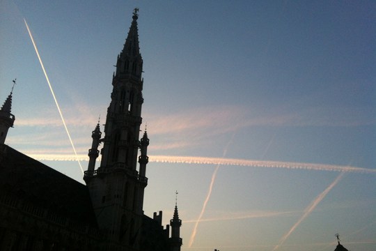 Airplane condensation trails in the Brussels sky - which "chemtrail" conspiracy theorists claim to be chemical substances governments spray to keep populations subdued. Photo Antonio Gomes da Costa