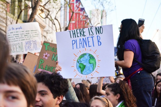 Person holding "There is no planet b" poster, Union Square, San Fancisco