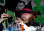 A woman and girl dressed as witches make potions.
